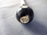 a black and white baseball bat with a flower design on it