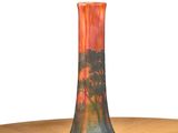 a vase that is sitting on a table with a white background