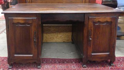 a wooden desk with a mirror on top of it