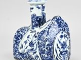 blue and white porcelain vase with a design of flowers and birds