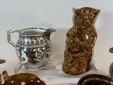 many different types of vases on display on the table