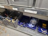 many bins of tools on the shelf in the kitchen
