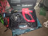 a tool in the case that is sitting on the floor