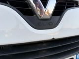 a close up of the front grille of a white car