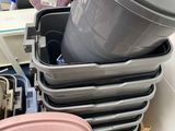many pots and pans stacked on top of each other in a box