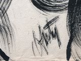 a black and white drawing of a woman ' s face on a piece of paper