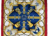 a square scarf with a blue and yellow design on it