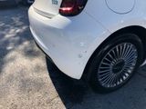 a white car parked on the side of the road