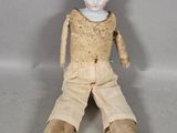 a small doll that is sitting on the floor