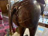 a statue of a horse that is standing on a table