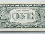 the back of a one dollar bill with a picture of an eagle on it