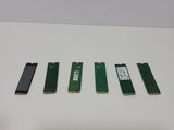 a close up of four different types of memory cards on a table