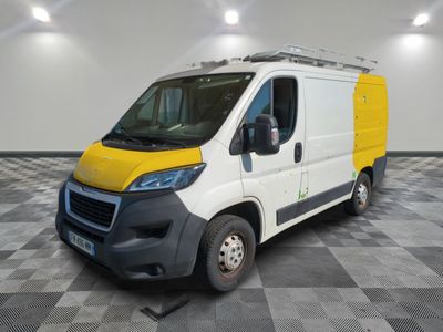 the yellow and white van is parked on a checkered floor