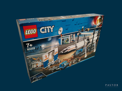 a box with a lego city set inside of it