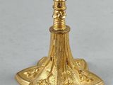 gold plated candle holder on a white background