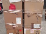 many boxes stacked on top of each other in a warehouse