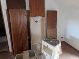 an empty room with a refrigerator and a refrigerator freezer in it
