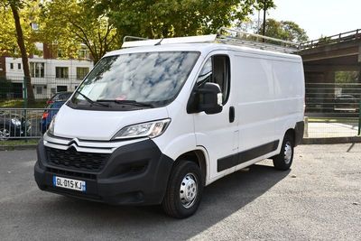 a white van that is parked in a parking lot