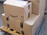 many boxes stacked on a pallet in a warehouse