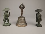 three bronze figurines of asian men with hats and umbrellas