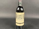 a bottle of wine sitting on top of a table