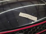 a sticker on the hood of a black car