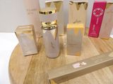 many different types of skin care products sitting on a table