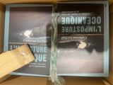 a book in a box with a piece of wood sticking out of it