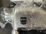 a close up of a toaster wrapped in plastic