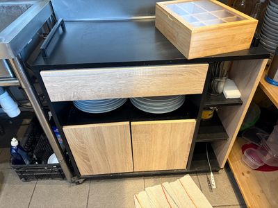 a kitchen with a sink, stove, and cabinets in it