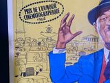 a poster with a picture of a man in a suit and hat