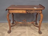 a small wooden table with a drawer on top of it