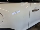 a sticker on the door of a white car