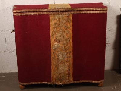 a red suitcase with a gold stripe on it