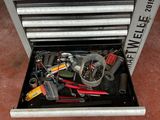 a tool box with tools in it sitting on the floor