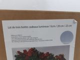 a box with a bunch of christmas decorations in it