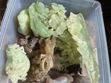 a plastic container filled with different types of food