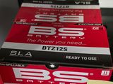 two boxes of red and black boxes with a yellow sticker on them