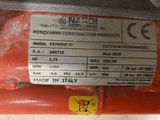 the label on the back of a red machine that is sitting on a table