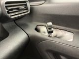 the interior of a car with the door open and a vent vent in the center of it