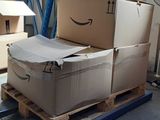 boxes on a pallet in a warehouse are stacked on top of each other