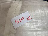 a label on the back of a chair that is wrapped in plastic