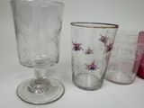 three glasses sitting next to each other on a table