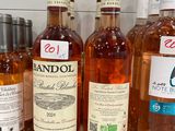 several bottles of alcohol are lined up on a counter