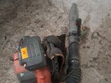 a blower that is sitting on the ground in the garage