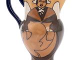 an image of a ceramic pitcher with a woman on it