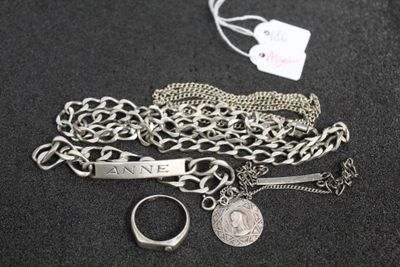 a silver chain with a silver ring and a silver chain with a silver ring