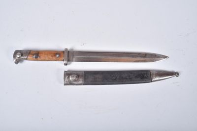 two knives that are laying next to each other on a table