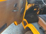 a close up of a car door with the driver ' s seat open
