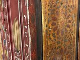 an image of a very old wooden cabinet with some paint on it
